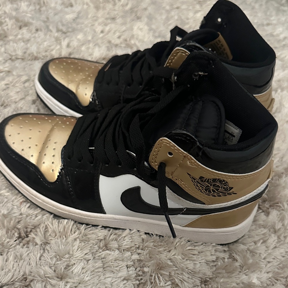 Jordan 1s gold toe Sneakers in Black, Gold, and White